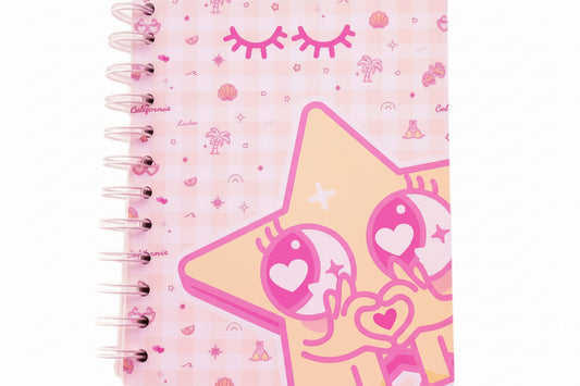 Notebook with SoCal's  storefront  design on a patterned background